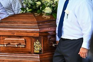 Pallbearers carry the casket of Irma Linda Garcia and her husband, Jose Antonio Garcia, during their funeral Mass at Sacred Heart Catholic Church in Uvalde, Texas, on June 1, 2022. - Irma Garcia, a teacher, was killed May 24 in the elementary school shooting and her husband Joe Garcia died two days later of a heart attack.