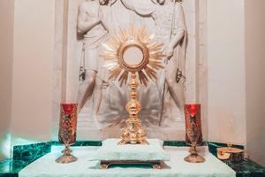 We adore Christ in the Eucharist.