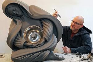 Timothy Schmalz puts the final touches on the “Life Monument.”