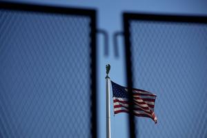 An American flag flies behind security fencing outside the U.S. Supreme Court on June 1, 2022 in Washington, DC.