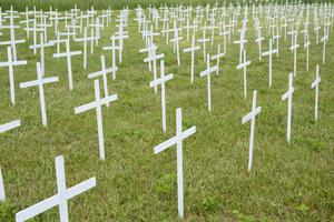 Many anonymous white crosses mark the graves of unborn children.