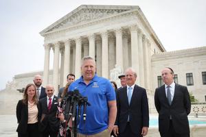 Former Bremerton High School assistant football coach Joe Kennedy answers questions after his legal case, Kennedy vs. Bremerton School District, was argued before the Supreme Court on April 25 in Washington. Two months later, the court gave him a 6-3 victory.