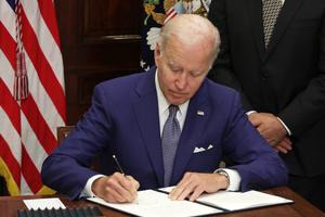 U.S. President Joe Biden signs an executive order on access to abortion during an event at the Roosevelt Room of the White House on July 8 in Washington. President Biden delivered remarks on so-called abortion rights at the event.