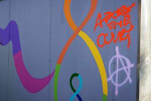 Spray-painted messages are seen at the Mother and Child Education Center in Portland, Oregon, on June 26 after the property was vandalized by demonstrators the night of June 25.