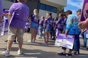 Supporters of Value Them Both, a constitutional amendment that would remove language guaranteeing the right to an abortion from the Kansas state constitution, rally before campaigning in Shawnee, Kansas, on July 30, 2022.