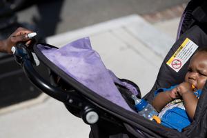 Rose Turner walks with her son, Robert Chase, while looking for a store with baby formula and money to buy it as the U.S. struggled with a shortage of baby formula May 19. Turner, who does not have a permanent home, came to Washington, D.C., with her 6-month-old son to be close to her mother while seeking refuge from an abusive partner. Similar situations often lead women to consider abortion, and the pro-life movement is working on new ways to make abortion unthinkable for women.
