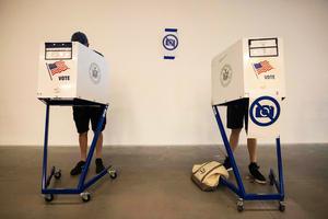 People vote during Primary Election Day on Tuesday in New York. The U.S. special election is being viewed as the last bellwether of the public mood ahead of November's midterms, as Democrats seek to make abortion a key issue in the campaign.