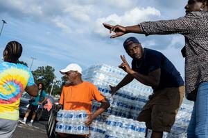 Cases of bottled water are handed out at a Mississippi Rapid Response Coalition distribution site on August 31, 2022 in Jackson, Mississippi.