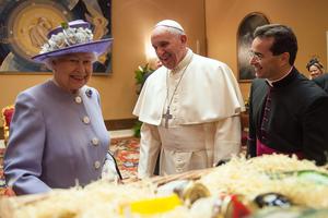 Queen Elizabeth II exchanges gifts with Pope Francis at the Paul VI Hall on April 3, 2014, in Vatican City, Vatican. 