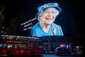 The advertising screens in Piccadilly Circus display an image of Queen Elizabeth II on Sept. 8 in London, England, the day she died at Balmoral Castle in Scotland.