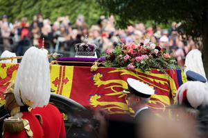 The Queen’s crown is seen atop her coffin as it is processed through central London. 