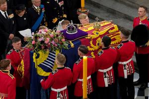 The bearer party with the coffin of Queen Elizabeth II as it is taken from Westminster Abbey on September 19, 2022 in London, England. The bearer party with the coffin of Queen Elizabeth II as it is taken from Westminster Abbey on September 19, 2022 in London, England.