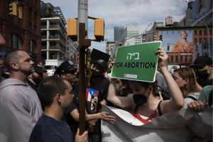 Father Fidelis Moscinski (far left, in gray robe), a well-known pro-life activist and priest of the Franciscan Friars of the Renewal (CFR), is seen during a tense standoff between pro-life and pro-abortion demonstrators in Lower Manhattan on July 2.