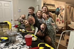 Mark Houck surrounded by his children at home. Mark Houck surrounded by his children at home.