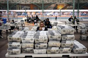 Election workers prepare ballots Friday at the Los Angeles County Registrar vote-by-mail operation center in City of Industry, California, for the Nov. 8 midterm election. Election workers prepare ballots Friday at the Los Angeles County Registrar vote-by-mail operation center in City of Industry, California, for the Nov. 8 midterm election.