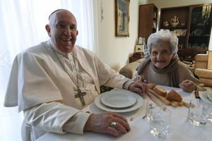 Pope Francis has lunch with his second cousin Carla Rabezzana at her home in Portacomaro, Italy, on Nov. 19.