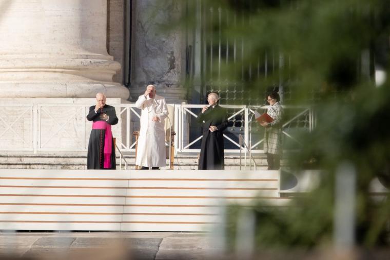 Pope Francis prays at the general audience on St. Peter's Square.