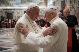 Pope Francis and Pope Emeritus Benedict XVI greet each other at the 65th priestly ordination of Pope Emeritus XVI at the Clementine Hall.