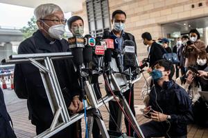 Cardinal Joseph Zen (l) speaks to the media outside the West Kowloon court building in Hong Kong on Nov. 25, after being found guilty and fined for failing to register a humanitarian relief fund. Cardinal Joseph Zen (l) speaks to the media outside the West Kowloon court building in Hong Kong on Nov. 25, after being found guilty and fined for failing to register a humanitarian relief fund.
