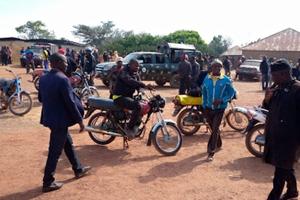 Police and residents of Wumat, a farming town 45 miles south of Jos, Nigeria, arrive to survey damage and help survivors of a terrorist attack on Nov 22, 2022.