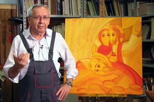 Jesuit Father Marko Ivan Rupnik stands before the official image he designed for the 10th World Meeting of Families in Rome.