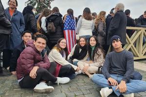 Juan Luis Tron (second from left) and Maria Magdalene Baca (second from right) together with other young people from the Regnum Christi movement wait outside St. Peter's Basilica on Jan. 2, 2023, to pay their respects to the late Pope Emeritus Benedict XVI, who died Dec. 31, 2022.