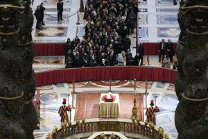 The body of Pope Emeritus Benedict XVI lies in state Monday in St. Peter's Basilica