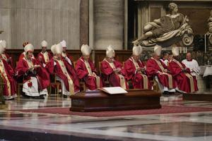 Cardinal George Pell's coffin in front of some of the cardinals who concelebrated his funeral Mass on Jan. 14, 2023