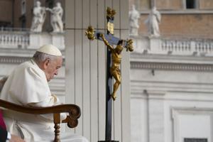 Pope Francis prays in front of a crucifix during his general audience on Oct. 26, 2022. Pope Francis prays in front of a crucifix during his general audience on Oct. 26, 2022.