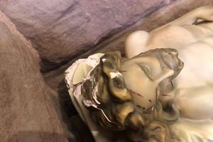 The statue, called “Christ in Death,” portrays Jesus’ corpse laying on a burial shroud with a crown of thorns laid alongside his lower legs. The statue, called “Christ in Death,” portrays Jesus’ corpse laying on a burial shroud with a crown of thorns laid alongside his lower legs.