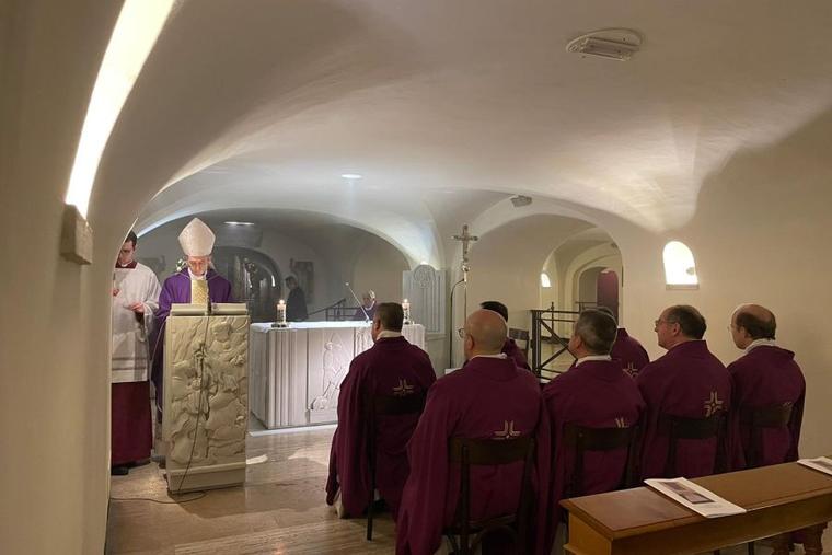 Archbishop Georg Gänswein celebrates Mass in the Vatican crypt close to the tomb of Pope Benedict XVI on Jan. 31, 2023, to mark one month since the death of the pope emeritus on Dec. 31, 2022.