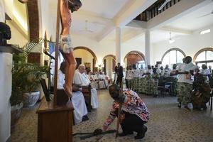 Young people from eastern Congo lay down the machetes and knives used to kill their families at the foot of Christ’s cross to symbolize their forgiveness in a moving encounter with Pope Francis during his trip to the country Feb. 1, 2023.