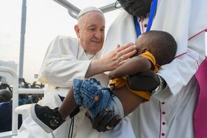 Pope Francis greets a young boy a Mass in Juba, South Sudan on Feb. 5, 2023. Pope Francis greets a young boy a Mass in Juba, South Sudan on Feb. 5, 2023.