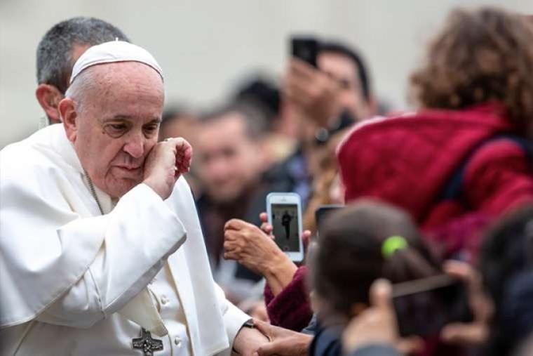 Pope Francis greets pilgrims before his general audience Feb. 26, 2020.