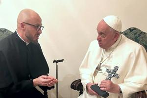 Father Vyacheslav Grynevych gave Pope Francis with a cross made out of broken glass and rubble from destroyed buildings in Kyiv on Feb. 21, 2023.