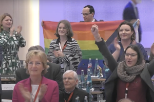 Delegates at the fifth assembly of the German Synodal Way, meeting in Frankfurt, Germany, on March 11, 2023, applaud after the he passage of a text calling for changes to the German Church's approach to gender identity. 