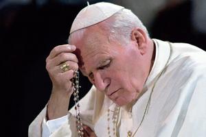 In this undated photo, Pope St. John Paul II is seen praying the Rosary.