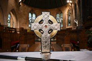 The Cross of Wales is displayed for a photograph ahead of a ceremony to bless the cross at Holy Trinity Church in Llandudno, north Wales, on April 19. The new processional cross presented by King Charles III as a centenary gift to the Church in Wales, is set to be used to lead the coronation procession at Westminster Abbey on May 6. The cross incorporates a relic of the True Cross, the personal gift to the king from Pope Francis.