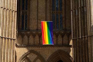 A pride flag hangs from the Peterborough Cathedral in England in 2019.