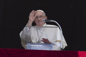 Pope Francis waves to the crowd in St. Peter's Square during his Angelus address on June 25, 2023.