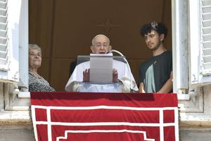 Pope Francis is flanked by a grandmother and grandson during his Angelus reflection on July 23, in honor of the World Day for Grandparents and the Elderly 2023.