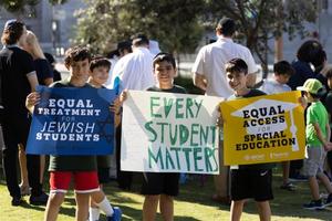 About 200 Orthodox Jewish families and individuals showed up for a rally outside a California court building on Friday, July 21, 2023, to express their support for religious liberty for disabled students.