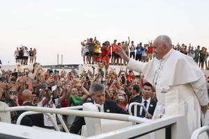Pope Francis waves to World Youth Day pilgrims in Lisbon, Portugal, at the start of a vigil service on Aug. 5.