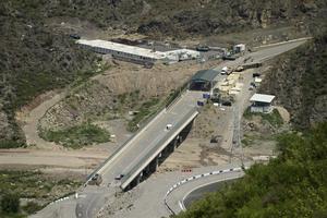 A bridge and a checkpoint are seen on a road towards the separatist region of Nagorno-Karabakh, in Armenia, Friday, July 28, 2023. The former chief prosecutor of the International Criminal Court warned that Azerbaijan is preparing genocide against ethnic Armenians in its Nagorno-Karabakh region and called for the UN Security Council to bring the matter before the ICC. 