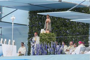 Cardinal Manuel Clemente, the Patriarch of Lisbon, greets attendees of World Youth Day at the opening Mass on Aug. 1, 2023, in Lisbon, Portugal.