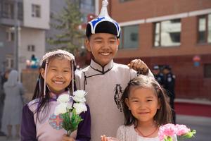 Schoolchildren eagerly wait for the pope’s arrival outside of the apostolic prefecture on Sept. 1, 2023, in Ulaanbaatar, Mongolia, where Pope Francis will be staying for the duration of his four-day visit to the country.