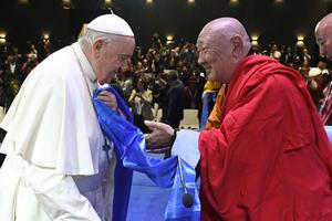Khamba Nomun Khan, the head of the Gandan Monastery in Ulaanbaatar, accompanied Pope Francis as he made his entrance at the interreligious dialogue event at the Hun Theater in Mongolia on Sept. 3, 2023.