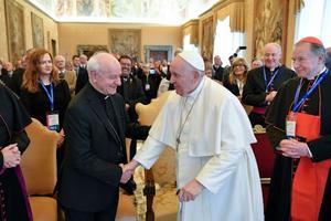 Pope Francis greets Archbishop Vincenzo Paglia, the president of the Pontifical Academy for Life, on Feb. 20, 2023.