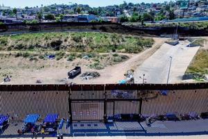 This aerial picture taken on Sept. 14 shows the U.S.-Mexico border fence with camp shelters left by migrants in San Ysidro, California. 