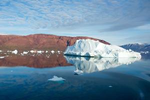 Iceberg floats freely in open water.